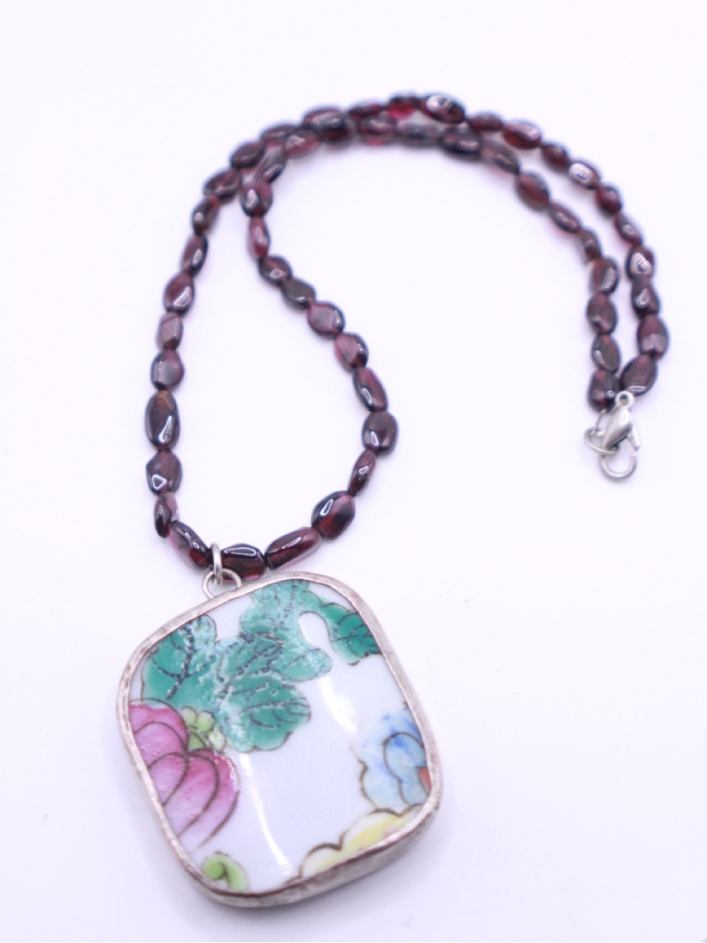 Artisan made Hand paintedPorcelain Floral Pendant on a Garnet Bead Necklace